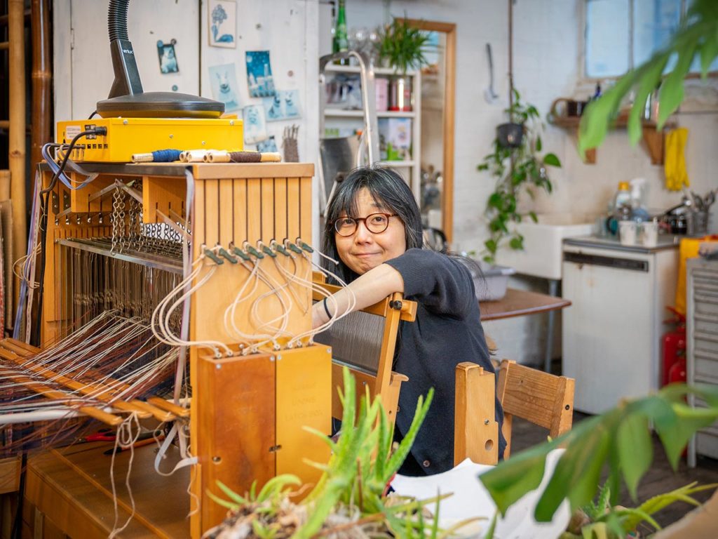 Mica working in her creative studio